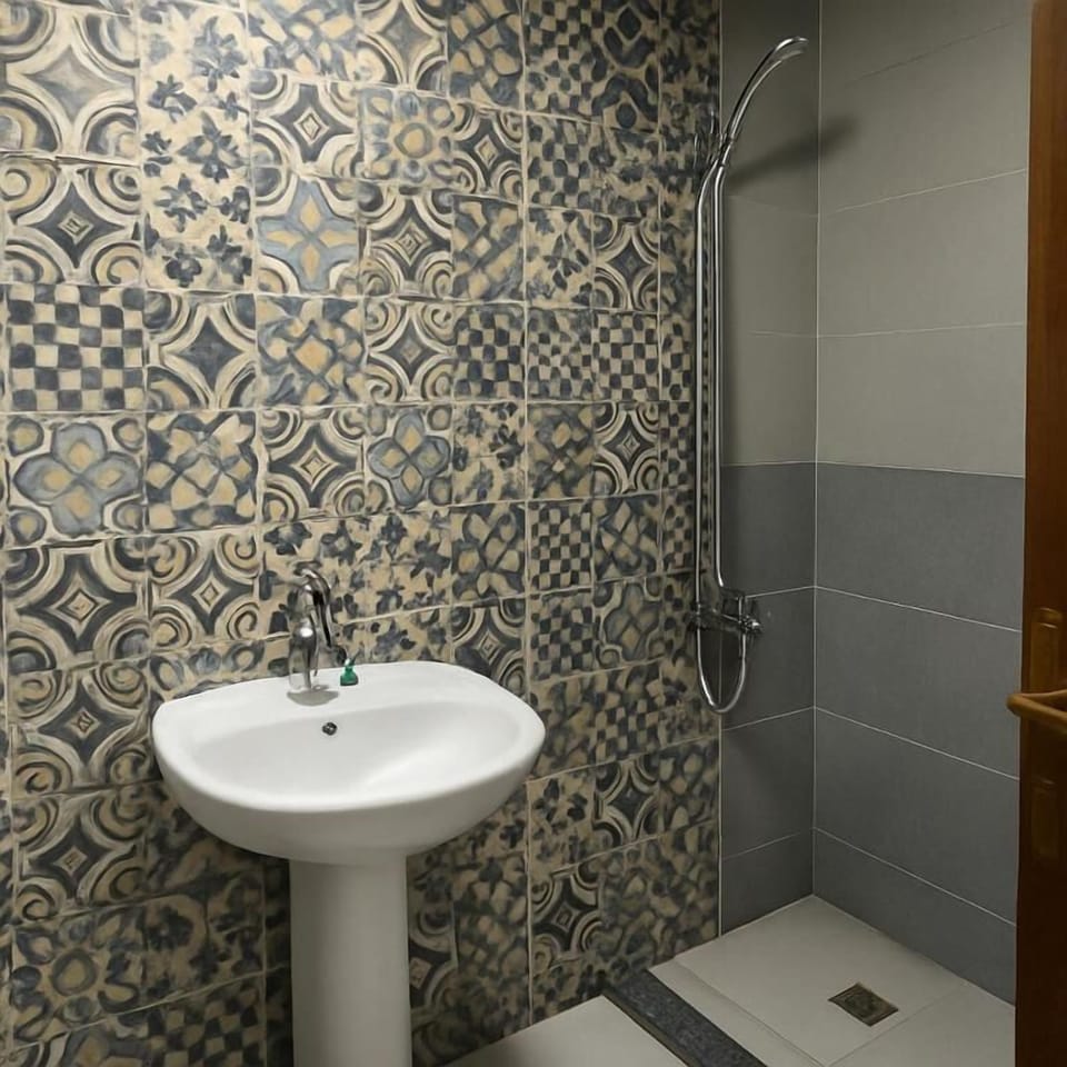 Premium Quadruple Room, Pool View | Bathroom | Shower, free toiletries, towels, soap