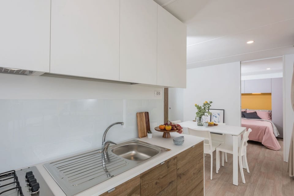 Full-size fridge, highchair, cleaning supplies
