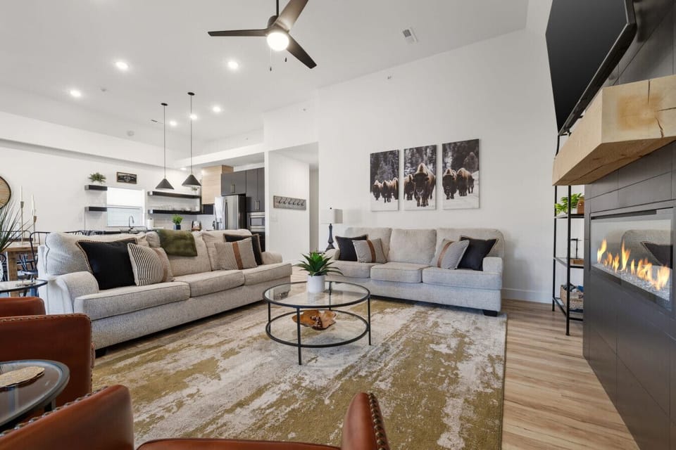 Spacious, cozy living area with fireplace- perfect for relaxing after a day at the pool