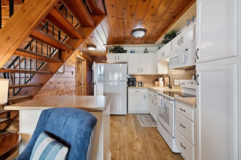 Well equipped kitchen with breakfast bar makes meals easy for the group.