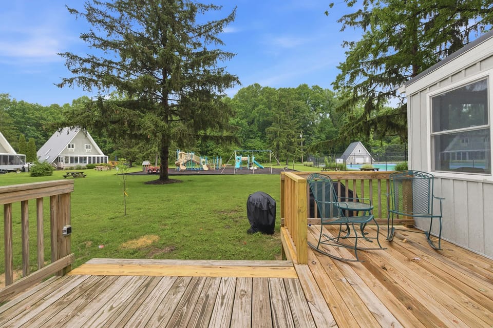 Outdoor seating faces the resort playground and pool for easy access to daily fun.