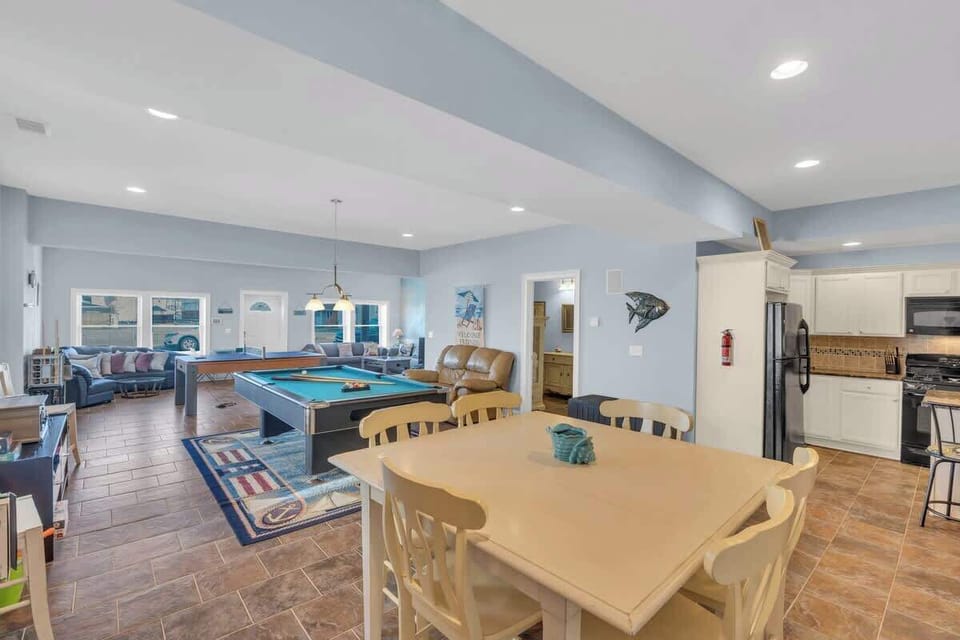 1st level dining area - seating for 8 (2 of the chairs are over by the pool table) - plus bar seating - mich larger dining table on 2nd floor 