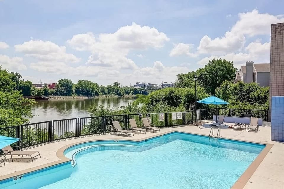 Communal Area: Sparkling blue pool with sun loungers and a view of the Cumberland River.