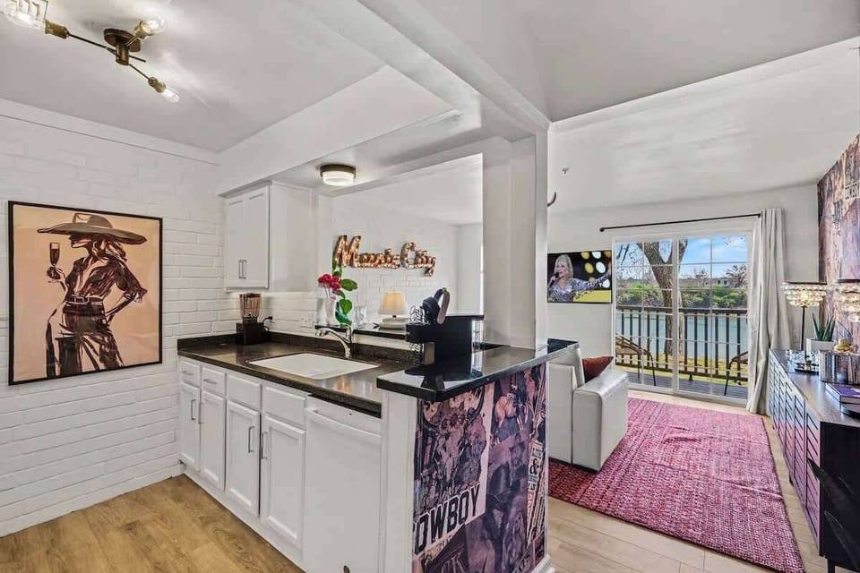 Fully equipped kitchen with stainless-steel appliances, ample counter space and bar seating for 2 guests.