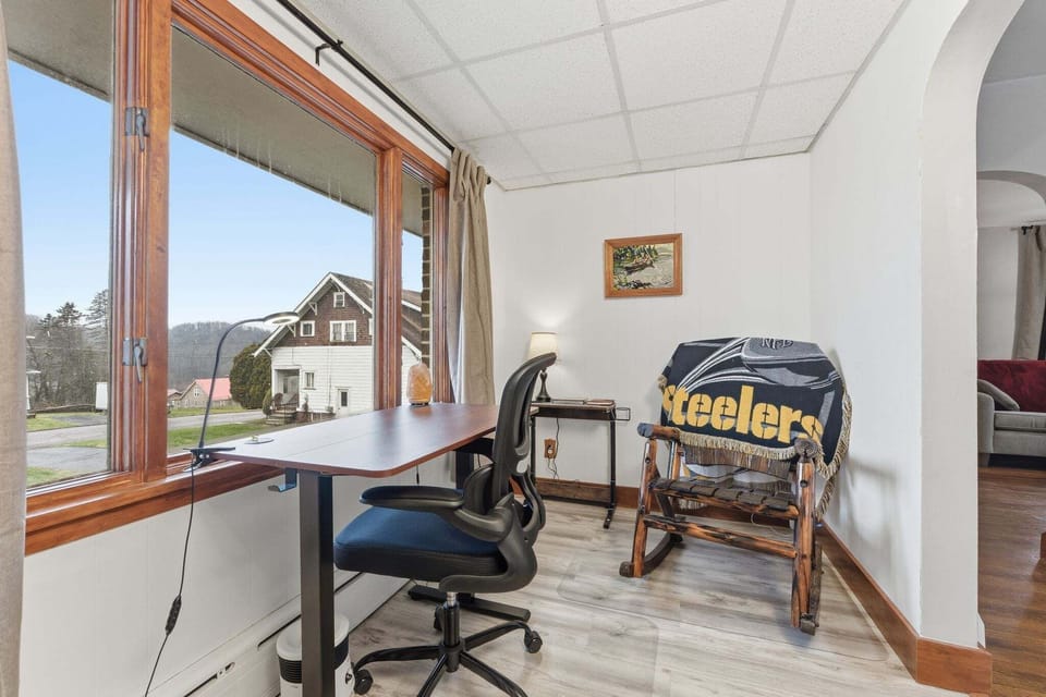 This dedicated work-space is adjacent to the dining room, living room, and downstairs bathroom. It offers privacy while still providing an open floor plan vibe, perfect for remote workers, students, and business travelers on extended stays. The floor plan is also intentionally designed to optimize the space for guests who prefer to avoid using stairs.