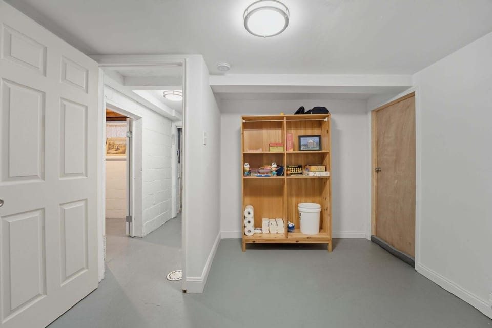 This bonus game-room in the finished basement offers space for a folding card table & sturdy chairs for use while playing games, arts/crafts, puzzles, etc. Extra storage and shelving full of family-friendly games and supplies are available for your use. Easy access to the 'Pittsburgh toilet' in the basement & laundry.