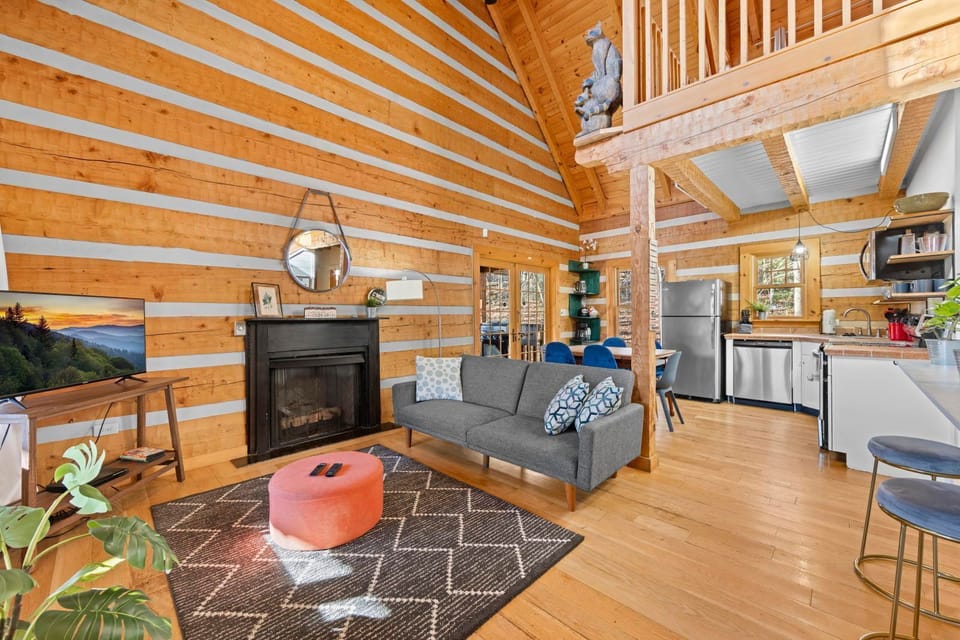 Gather around the cozy living space, with a warm fireplace and inviting decor for a perfect evening in.