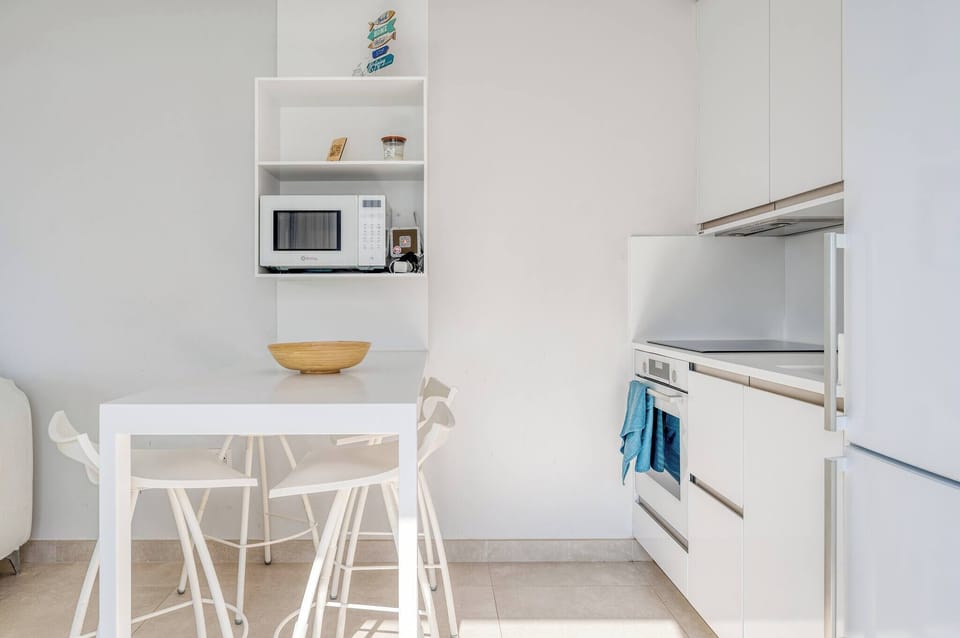 Dining area with table and chairs within the kitchen, perfect for enjoying meals comfortably and conveniently