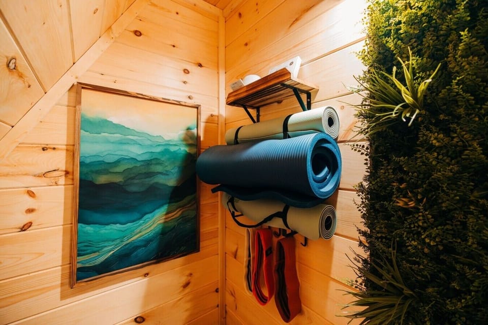 Start the morning stretching with yoga mats and simple wellness gear before heading out for your hiking retreat