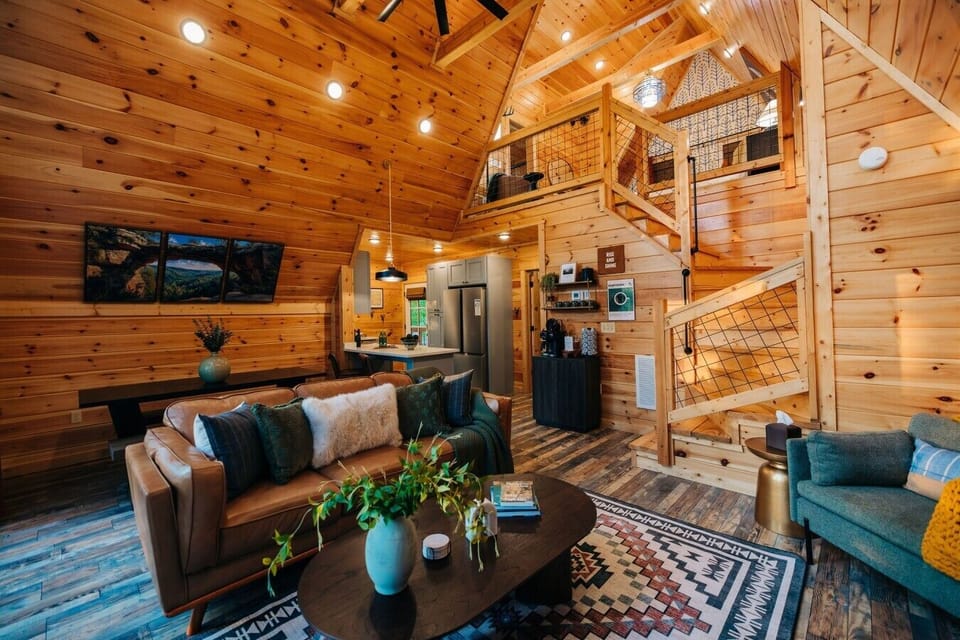 Settle into the open-concept cabin space where the living room, kitchen, and loft feel connected for group stays