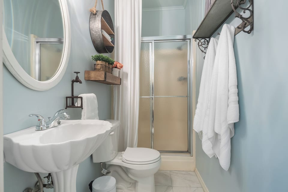 Treasured Mist Suite | Bathroom | Hair dryer, towels, soap, shampoo