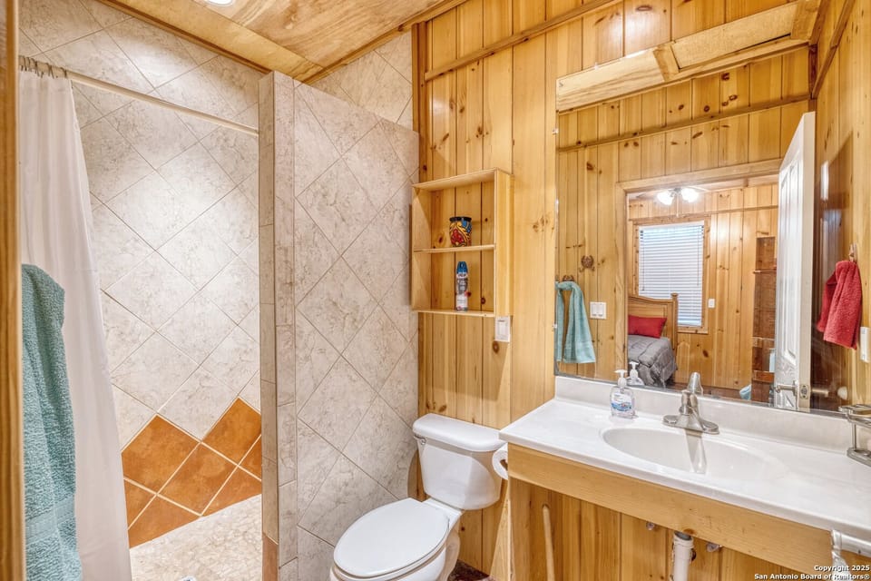 Walk-in shower plus a spacious vanity and large mirror