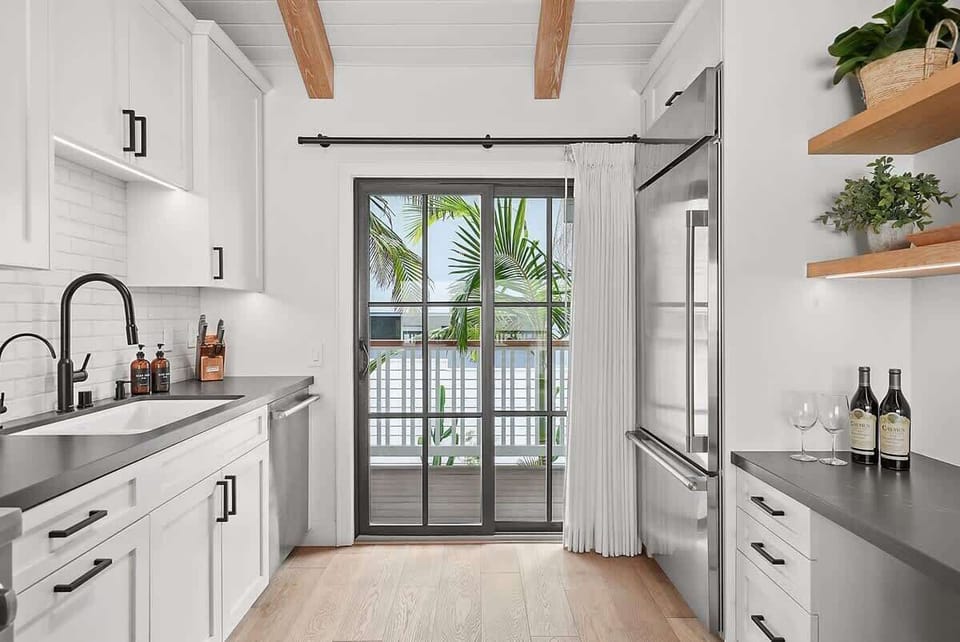 The kitchen is equipped with premium appliances and modern fixtures.