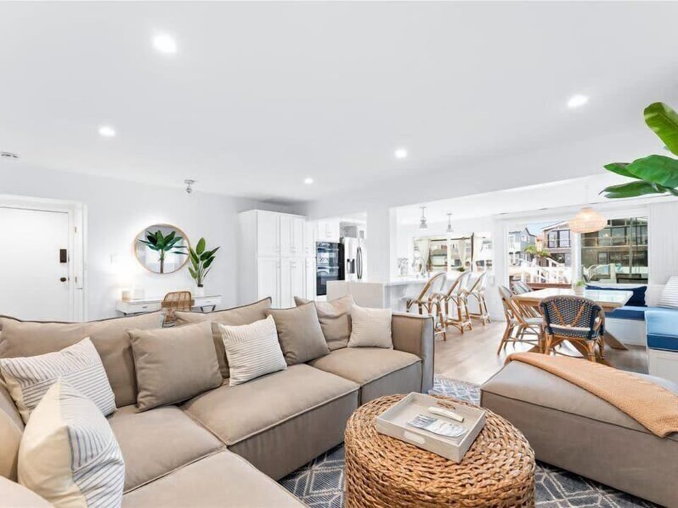 The living space offers plenty of natural light and a cozy fire place. It also provides outdoor access to your private deck that overlooks the bay.