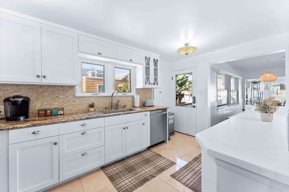 The kitchen is fully equipped with all cooking essentials and features top tier appliances.