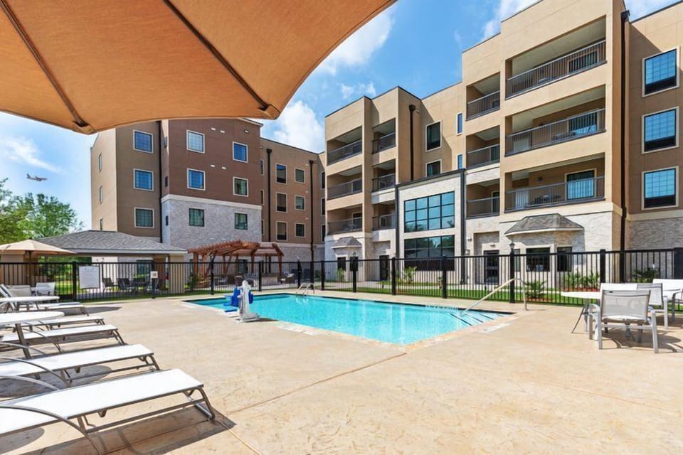 Dive into relaxation by the pool, where sunshine, lounge chairs, and fresh air await you.