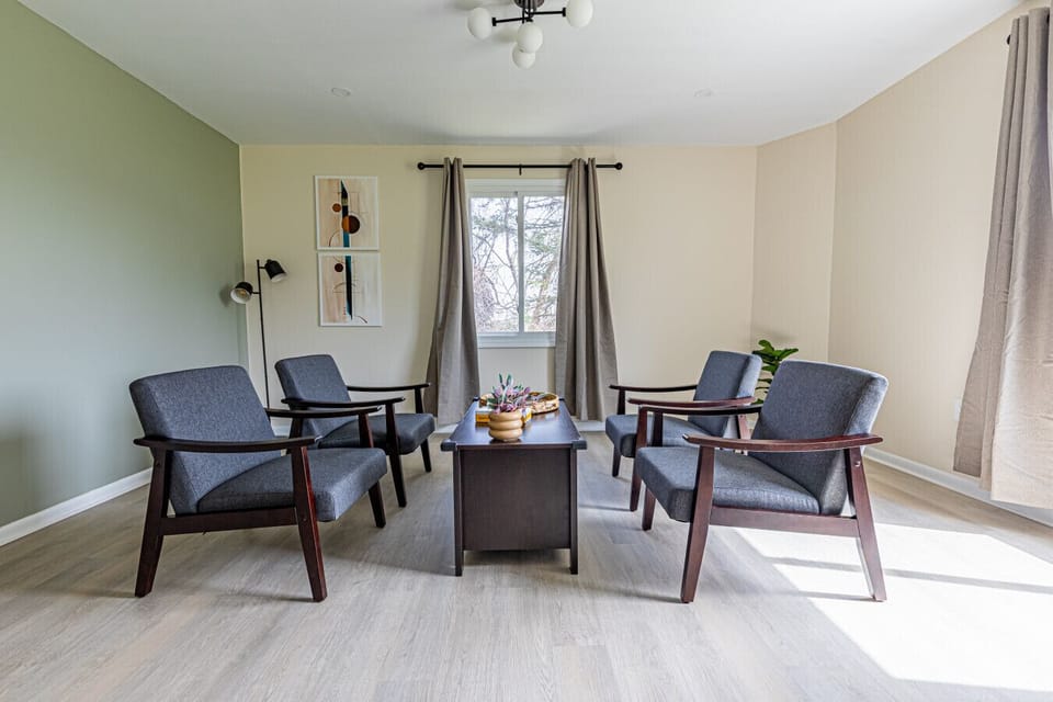 Inviting dining area with ample seating, perfect for enjoying home-cooked meals, family gatherings, or game nights in a warm and welcoming setting.