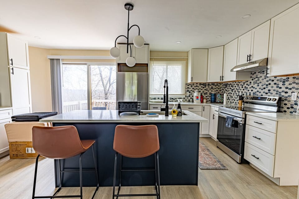 Fully equipped kitchen with everything you need to cook and dine in, featuring modern appliances, and a seamless flow into the living area.