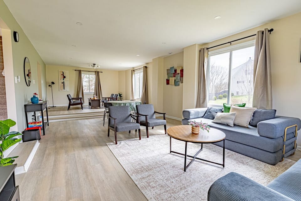 Spacious and comfortable living room with cozy seating and 2 sofa beds, perfect for relaxing, streaming your favorite shows, or gathering with family and friends.