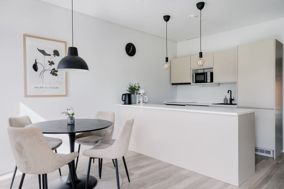 Enjoy a home-cooked meal in our bright, open-plan dining area, featuring a fully equipped kitchen with everything you need for a short or long-term stay.
