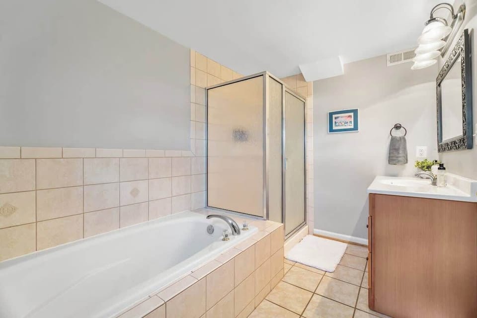 Spa-Like Retreat: Indulge in a relaxing soak or refreshing shower in this stylish sanctuary!