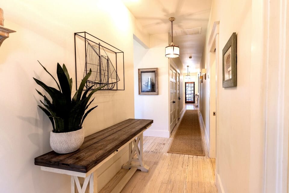 Downstairs hall view towards front entry door.