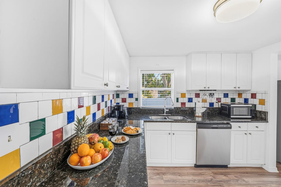 Clean and functional kitchen with ample counter space and natural light.