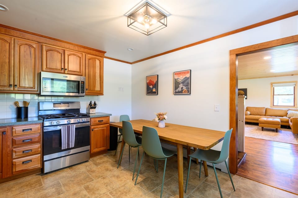 Fully functional kitchen with pots, pans, blender, mixer, plates, utensils, bowls, cups, wine glasses, cooking sheets, tubberware, coffee, sugars, creamers, and more! 