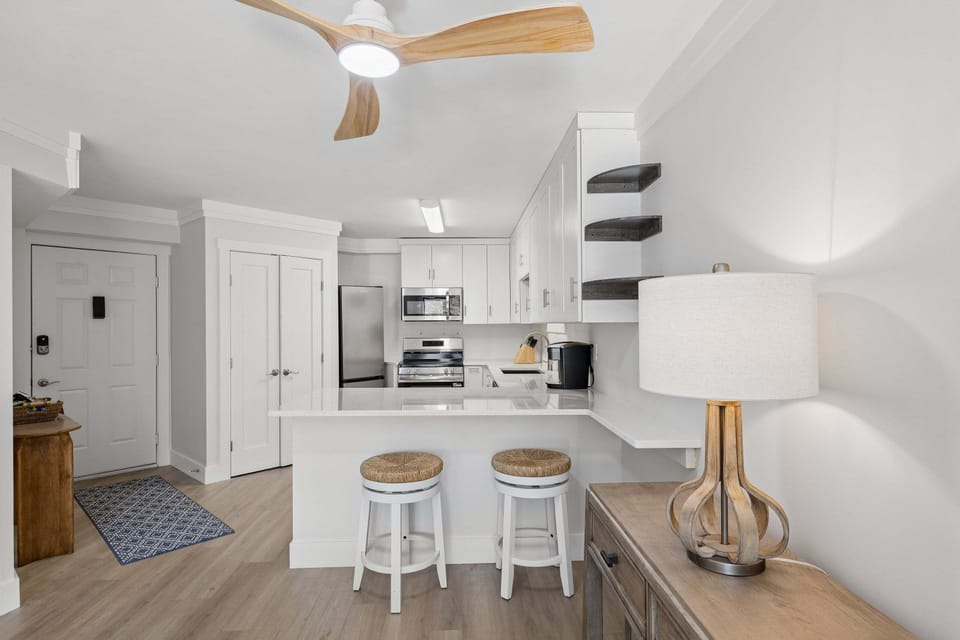 Just off the entryway, the fully equipped kitchen makes meal prep easy and enjoyable.