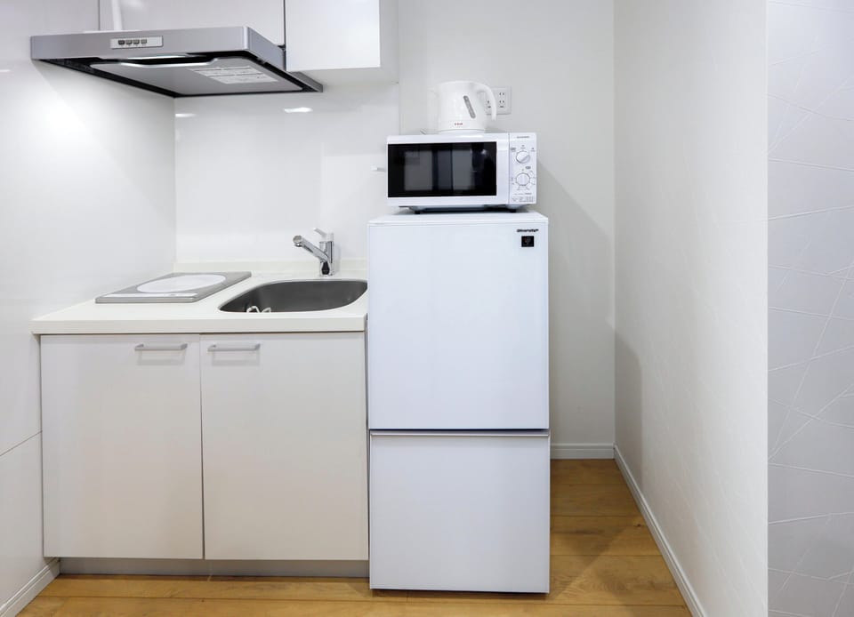 Apartment | Private kitchen | Fridge, microwave, stovetop, cookware/dishes/utensils