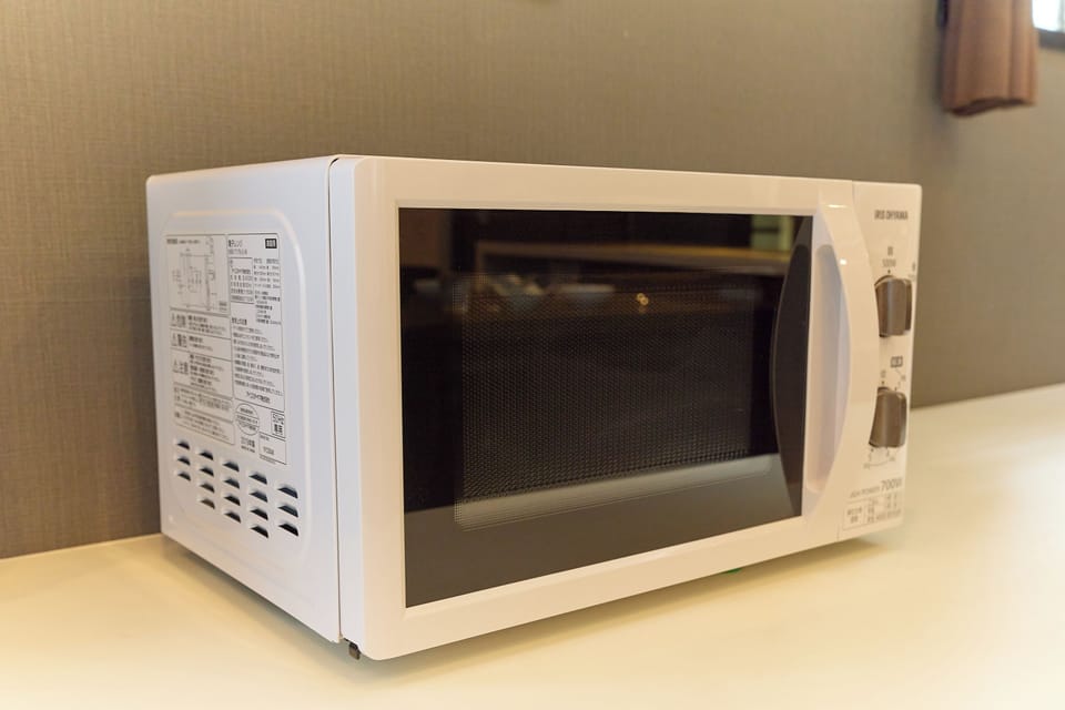 Apartment | Private kitchen | Fridge, microwave, stovetop, cookware/dishes/utensils