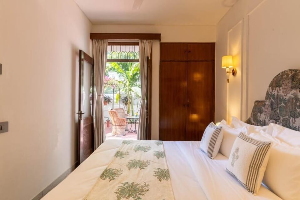 Deluxe Double Room, Patio, Garden View | In-room safe, desk, laptop workspace, blackout drapes
