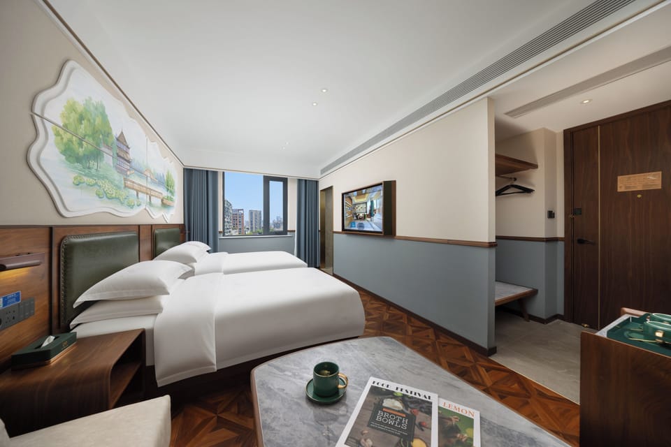 Family Quadruple Room | Free minibar, desk, laptop workspace, blackout drapes