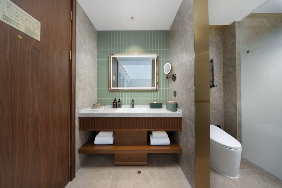 Superior Double Room | Living area | 55-inch LCD TV with cable channels, pay movies, smart speakers