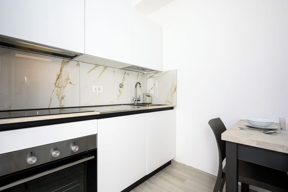 Apartment, Sea View | Private kitchen | Fridge, microwave, oven, stovetop