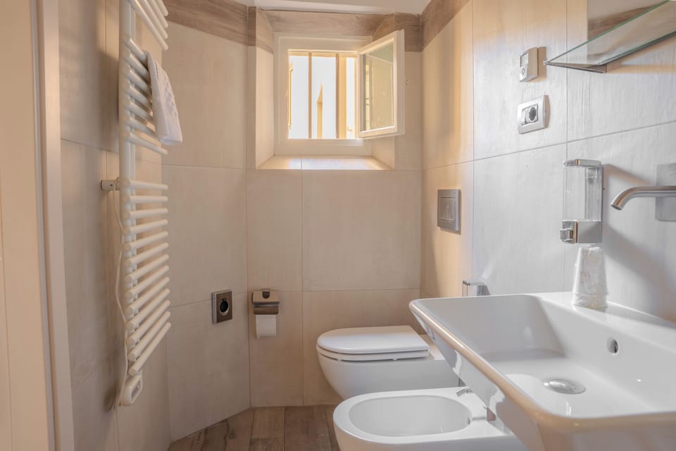 Bathtub, hair dryer, towels, soap