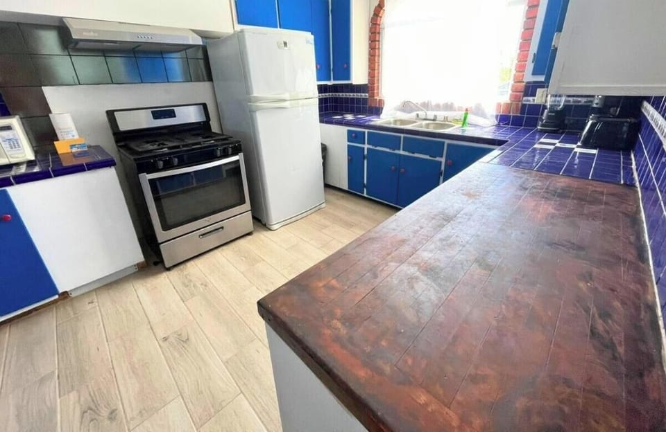 Cook with ease in the full kitchen at this Casa Barber vacation rental in San Felipe BC — modern appliances and plenty of counter space make meal prep simple.