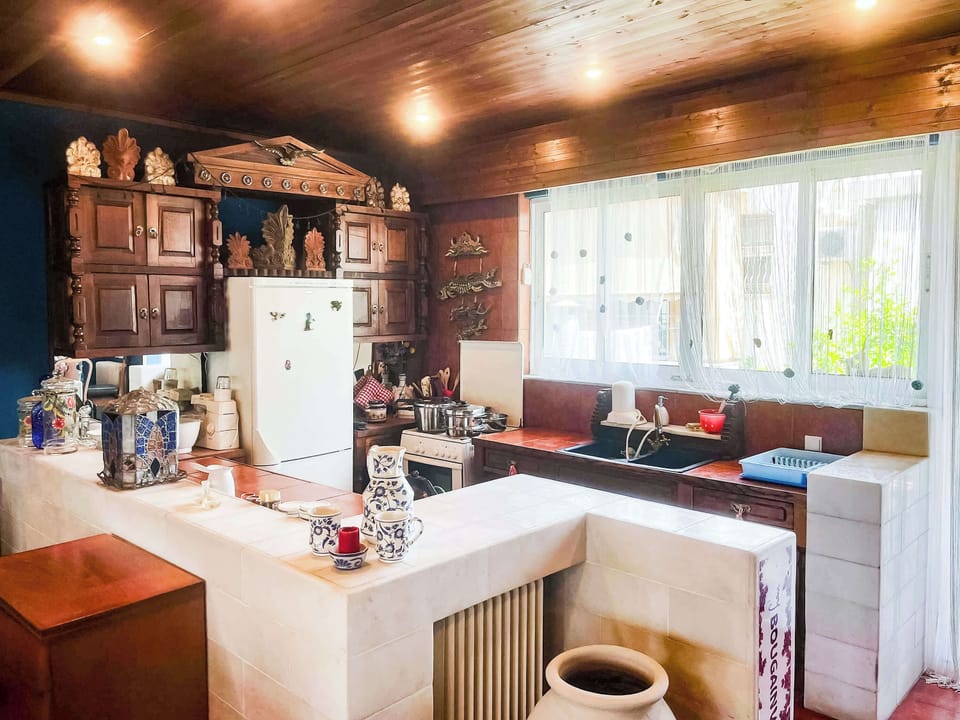 Fully equipped kitchen with generous workspace and traditional design elements, perfect for preparing homemade meals during your stay.