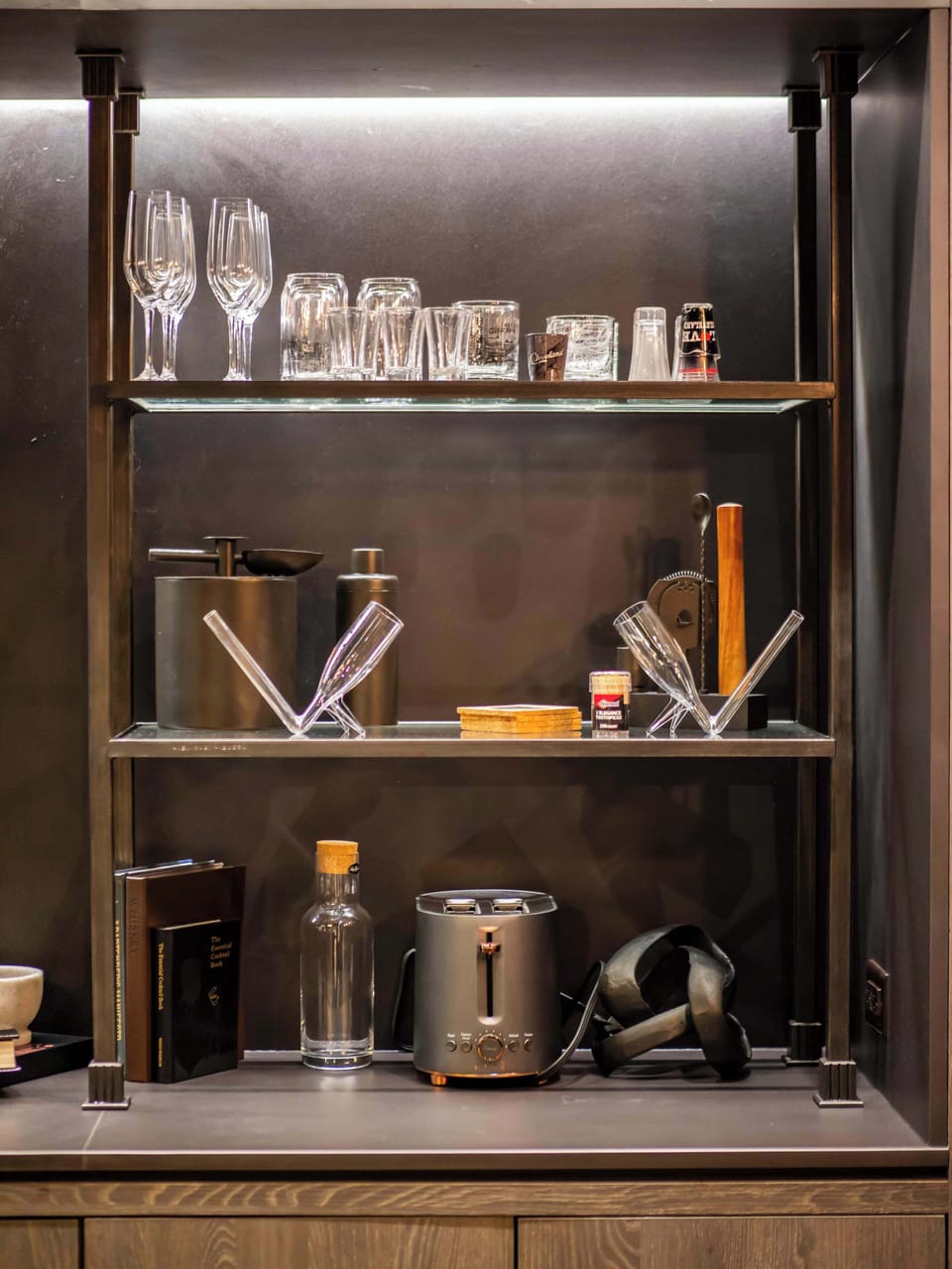 Open shelving w/ glassware & warm wood tones adding a stylish touch