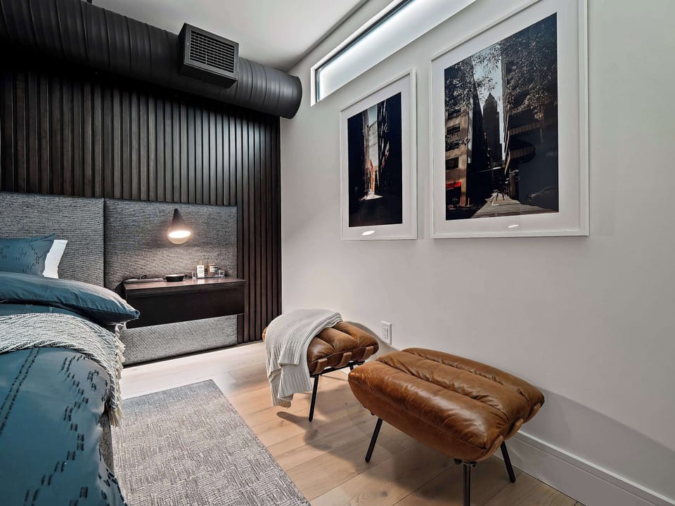 Bedroom nook w/ accent chair, wall art & a quiet place to unwind