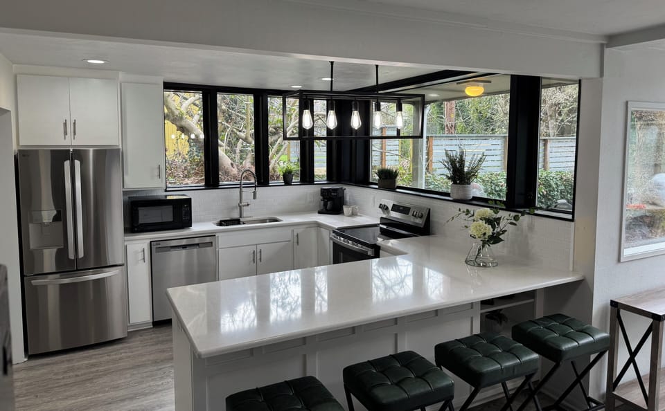 Large open kitchen with stainless steel appliances