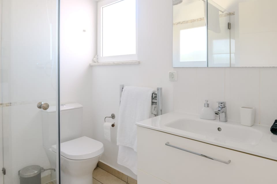 En-suite of Twin Bedroom 1 with a walk in shower.