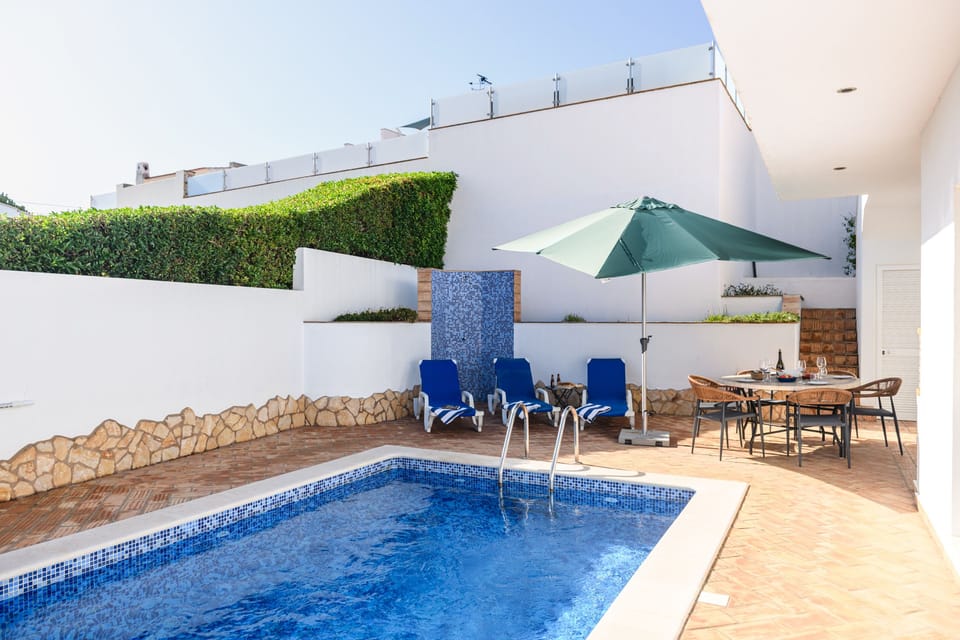 Complete with an outdoor shower, this pool area has everything you'll need for a great holiday