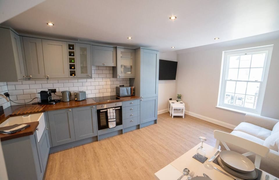 Open plan fully equipped kitchen, living & dining area