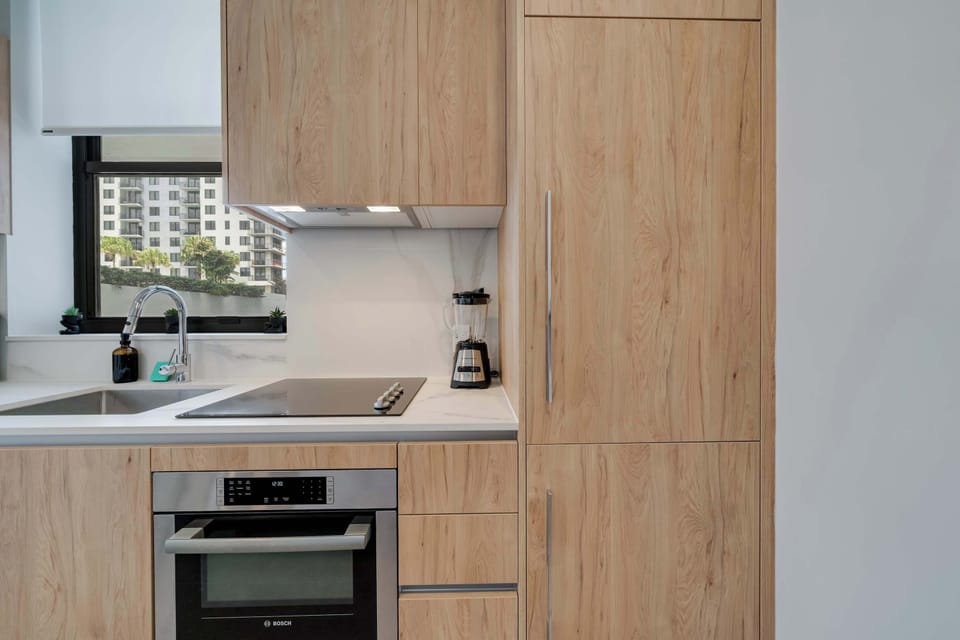 Sleek glass cooktop and integrated oven, ready for your home-cooked meals
