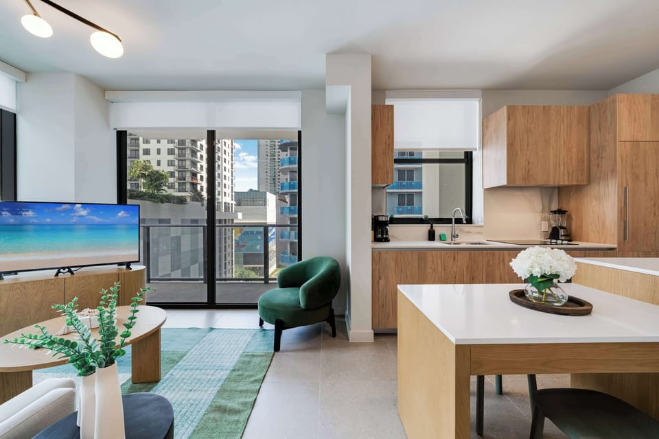 Fully equipped chef's kitchen with sleek cabinetry and premium appliances in an open space 