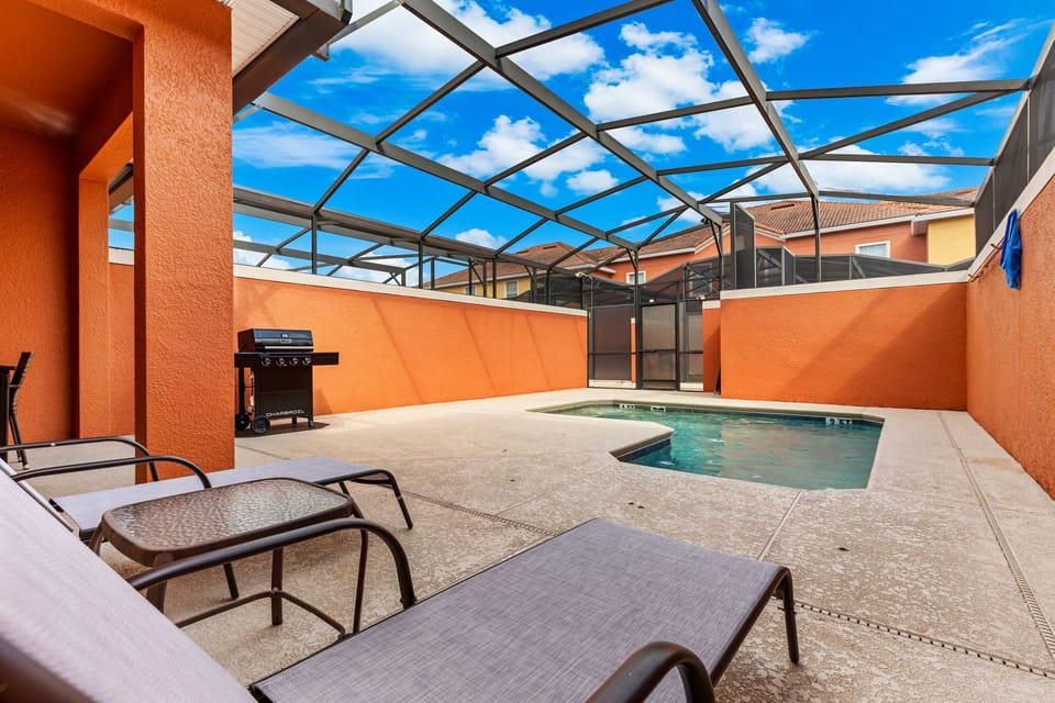 Enjoy a refreshing dip in the home’s private screened pool