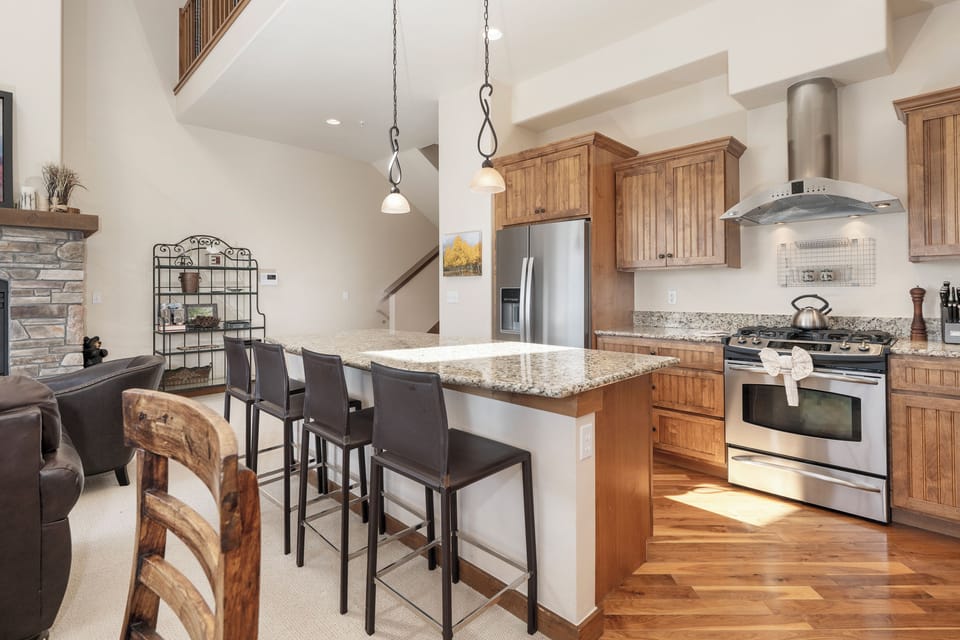 Cook memorable meals in your fully equipped kitchen featuring granite countertops, stainless steel appliances, and a spacious island perfect for gathering.