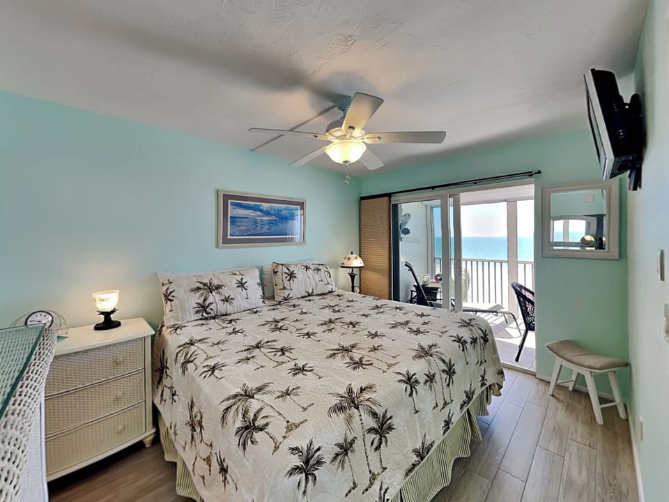 Primary Bedroom - King Bed, TV, Lanai Access + Ensuite Bathroom