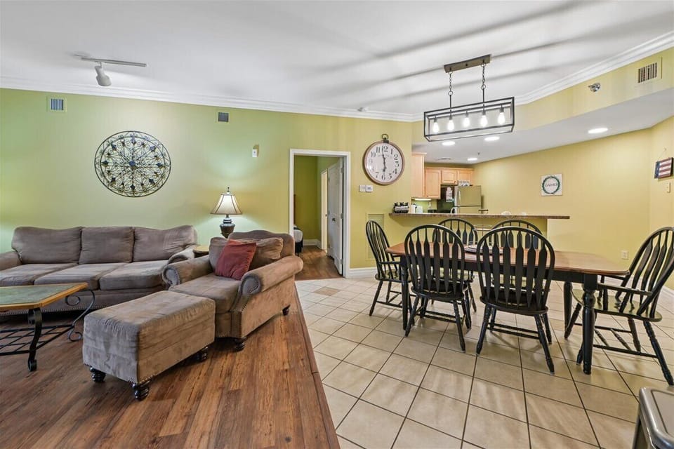 Relax in your spacious open-plan living area with comfortable seating and a fully equipped kitchen for family meals.